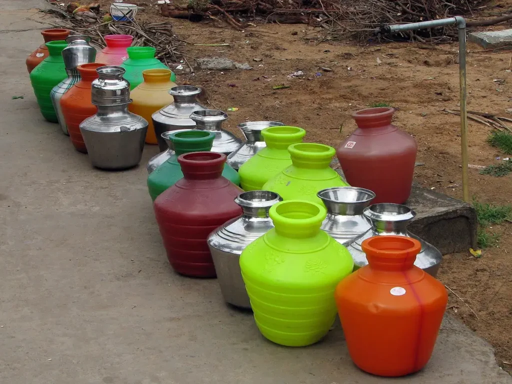 India - Colours of India - 014 - Water pots lined up for filling