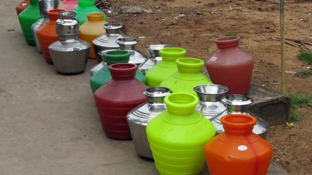 India - Colours of India - 014 - Water pots lined up for filling