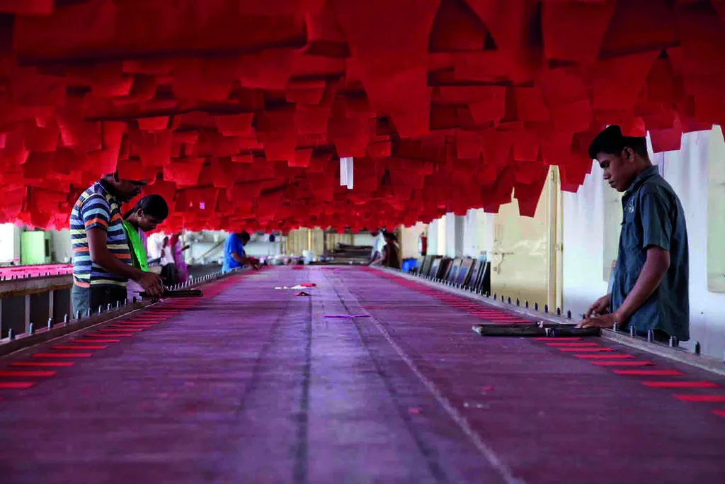 Garment workers in an Indian factory, whose provident fund savings are covered by EPFO rules