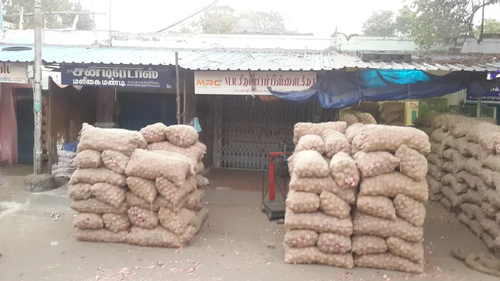 Sacks of onions at a wholesale onion mandi in India