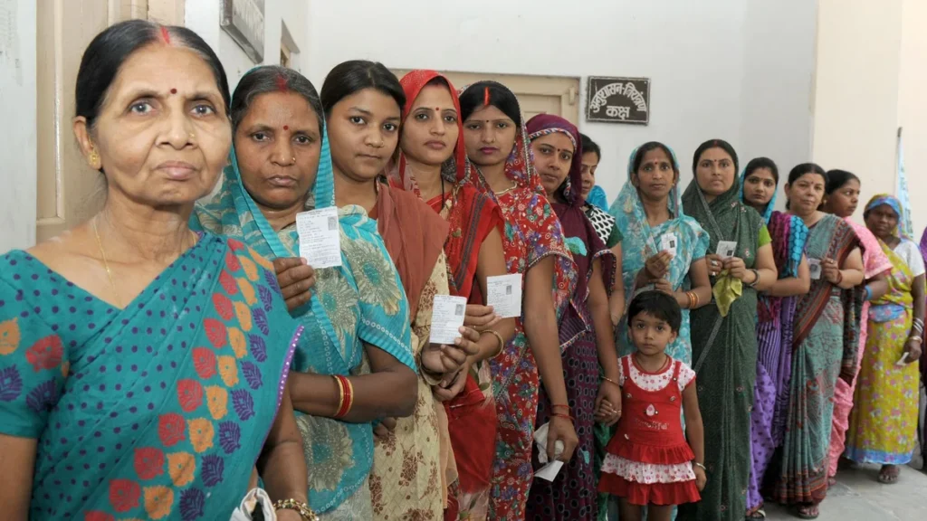 Women voters queuing at a polling booth in Varanasi, Uttar Pradesh