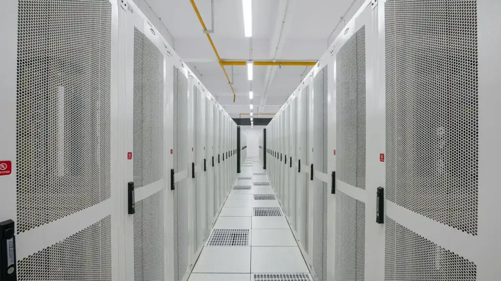 Long aisle of server racks inside a data centre in Amaravati
