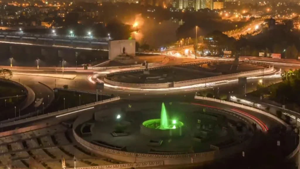 Lucknow skyline with a lit roundabout and fountain at night