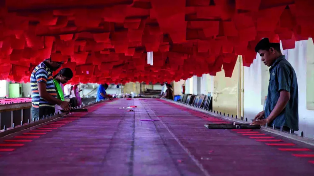 Workers at a garment and textile printing unit in Tiruppur, India