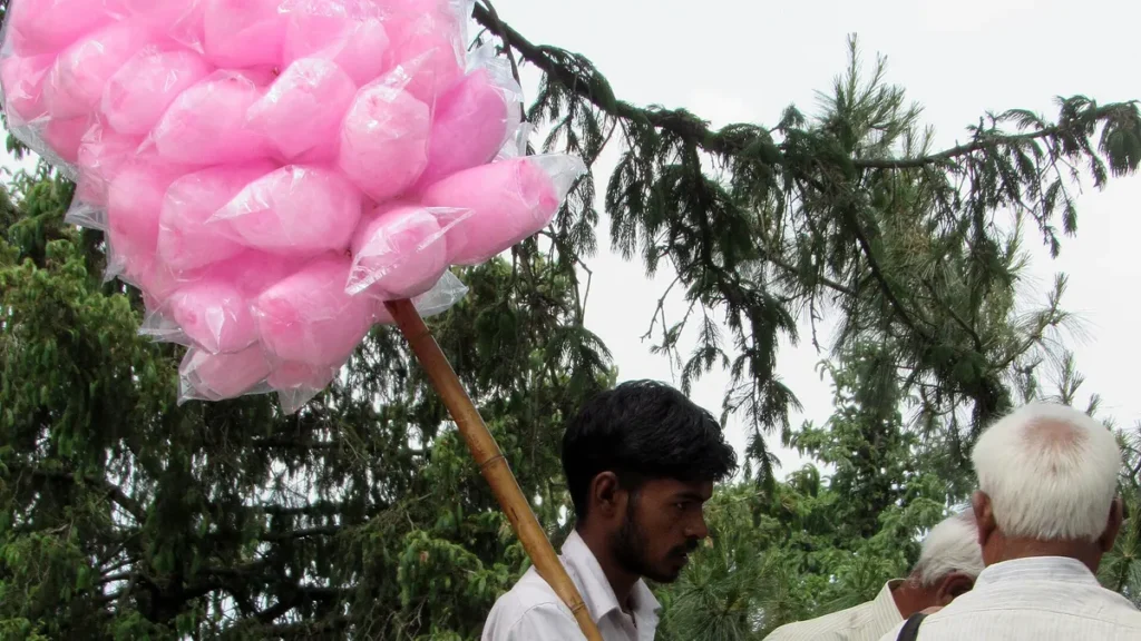 A vendor selling pink cotton candy, a sweet often coloured with banned Rhodamine-B