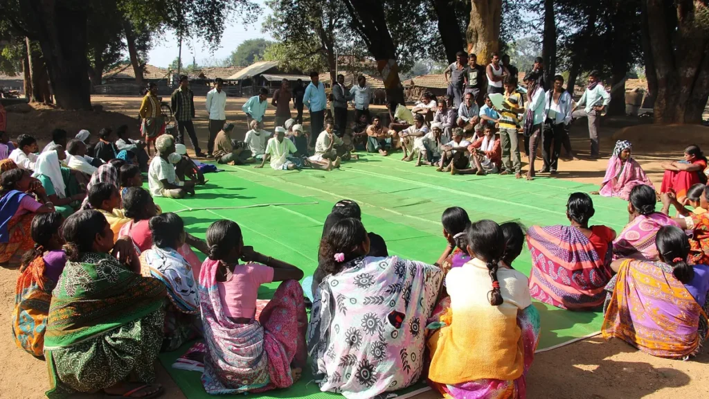 Villagers seated at a gram sabha meeting in Mendha Lekha, Maharashtra