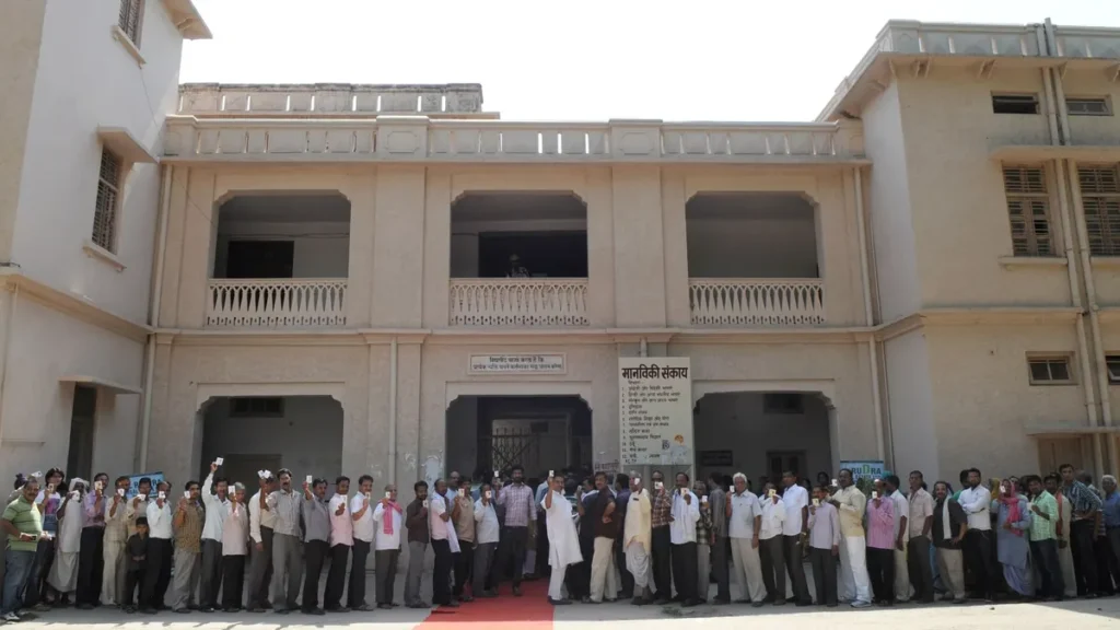 Voters standing in a queue at a polling booth in Varanasi, Uttar Pradesh