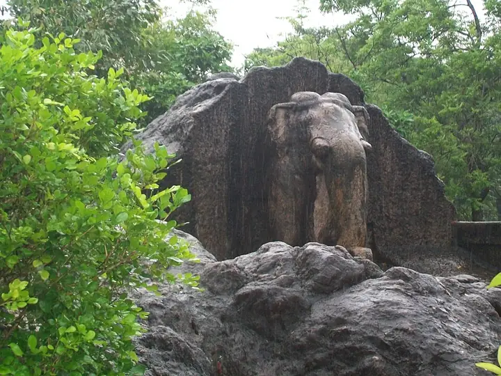 The rock-cut elephant above the Ashokan edicts at Dhauli, near Bhubaneswar, Odisha. At Kalinga, two special edicts replace Rock Edicts XI – XIII