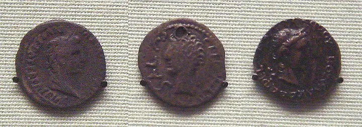 A silver denarius of Tiberius found in India (left), an Indian copy of it (centre) and a Kushan coin copying Augustus (right). Coins like these show how Roman money flowed into India