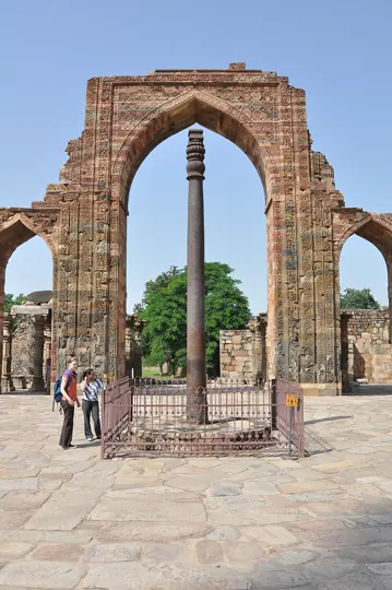The Iron Pillar in the Qutb complex, Mehrauli, Delhi. Its inscription names a king Chandra, usually taken as Chandragupta II, and it has barely rusted in 1,600 years
