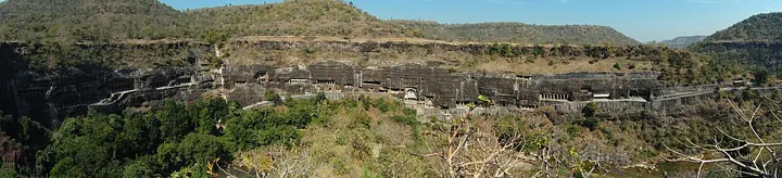 The Ajanta caves, cut into a horseshoe-shaped cliff above the Waghora river, Maharashtra