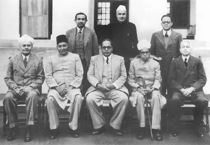 Ambedkar (seated, centre) with members of the Drafting Committee, 29 August 1947