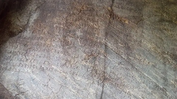 The shelter over Ashoka's Major Rock Edicts (Brahmi) at Girnar, Junagadh